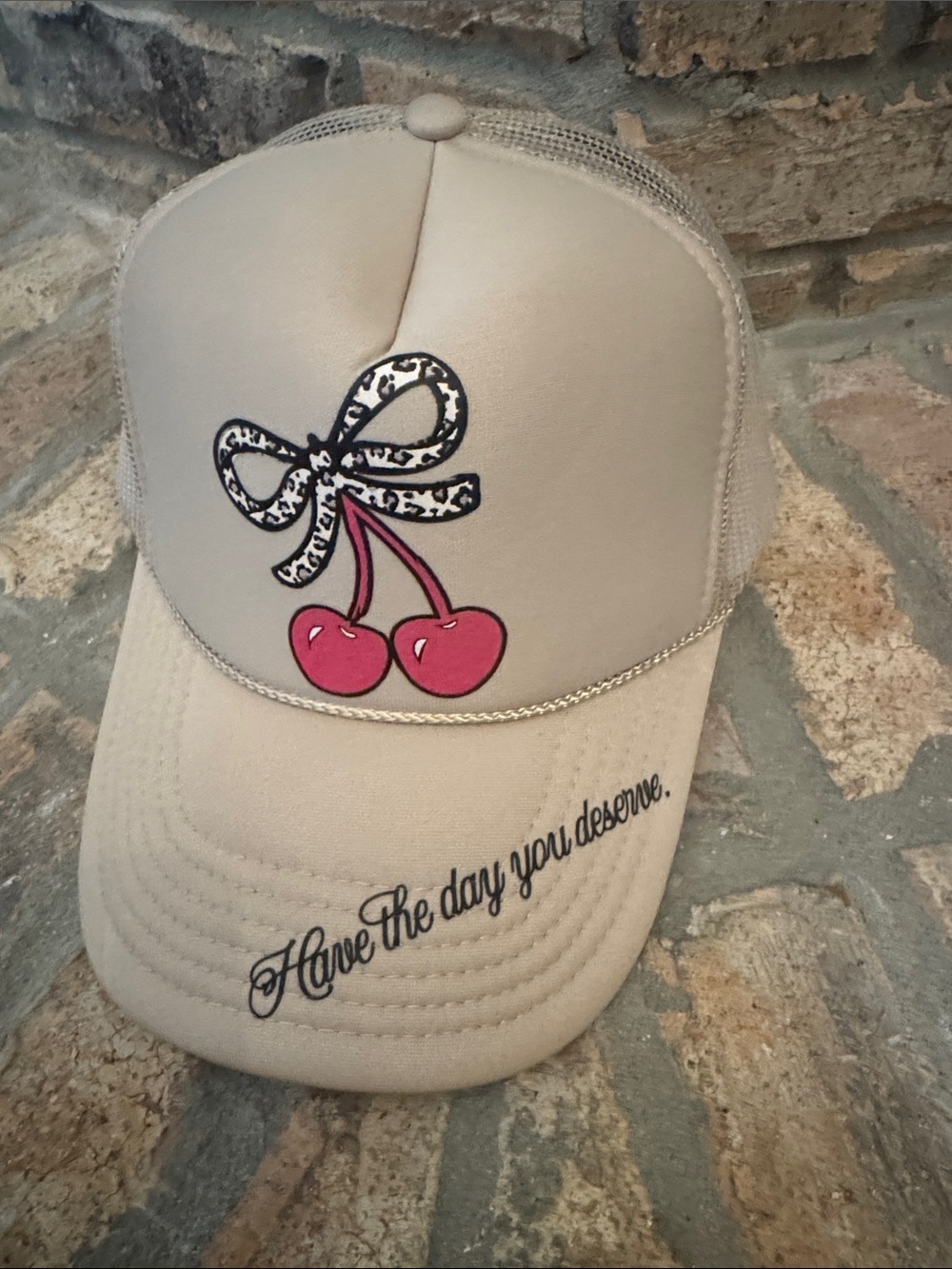 Have The Day You Deserve Beige Trucker Hat with Pink Cherry Accent
